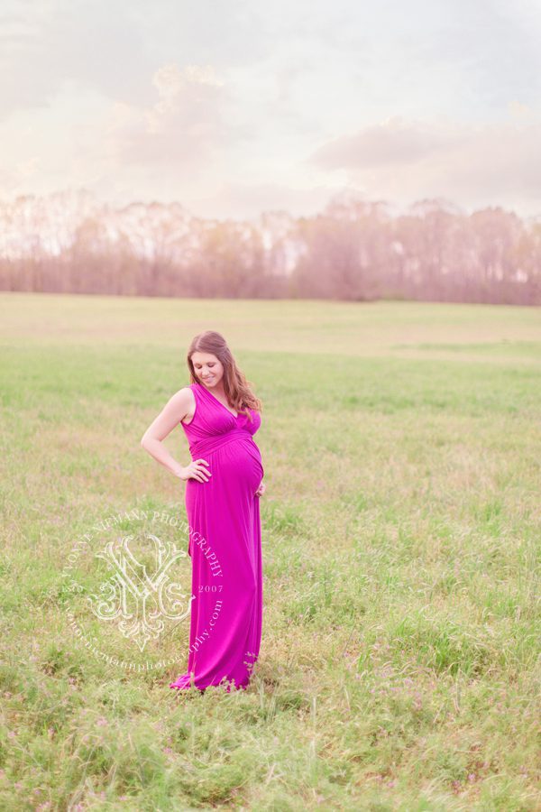 Outdoor maternity photography in Athens, GA area in a field of flowers.