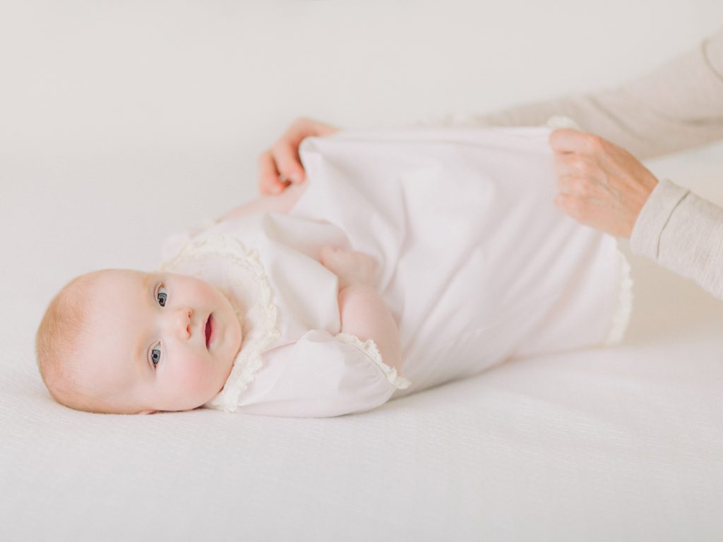 Four month baby milestone using family heirloom dress in Athens, GA.
