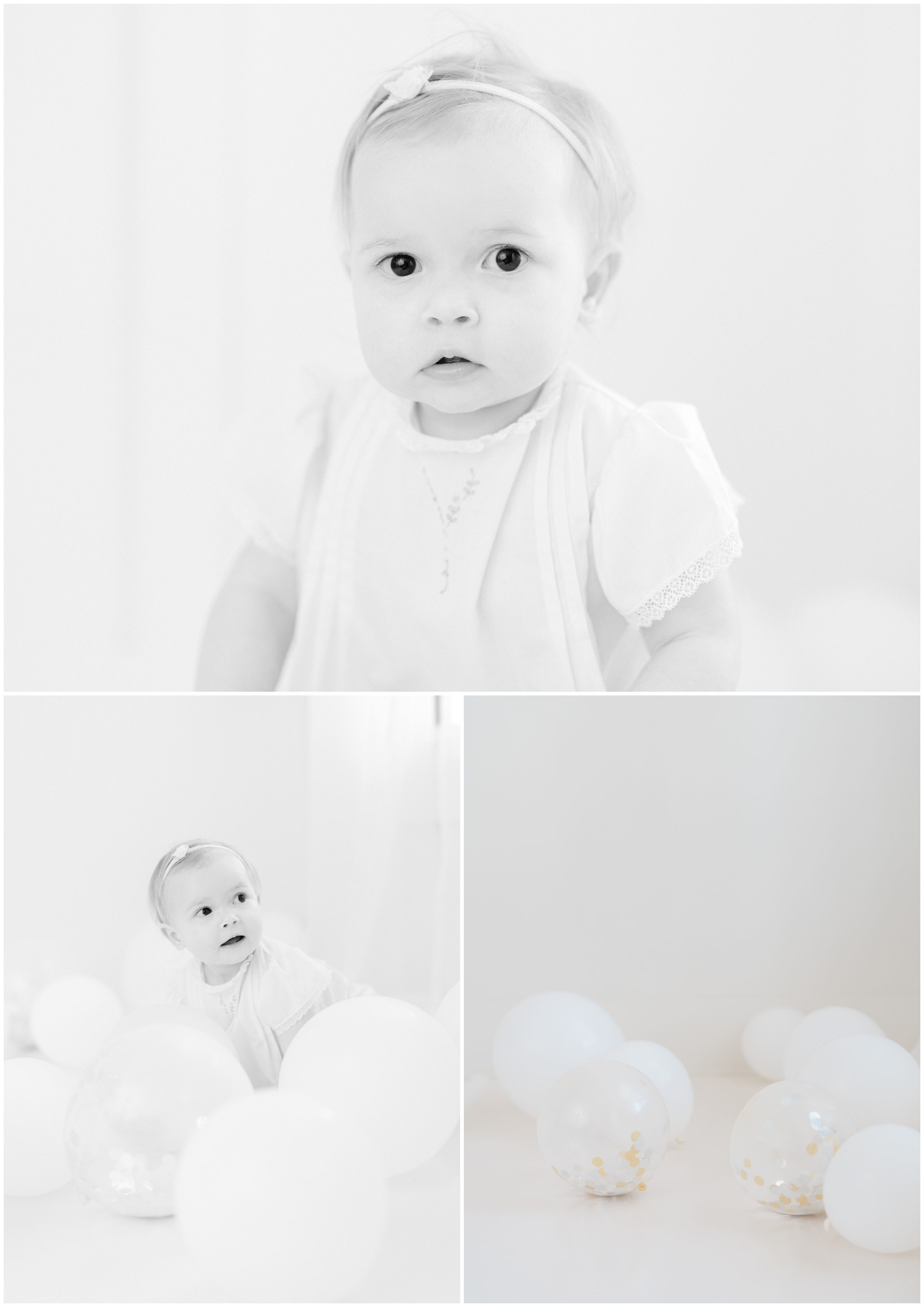 Classic first birthday photoshoot with baby girl in a white dress and balloons