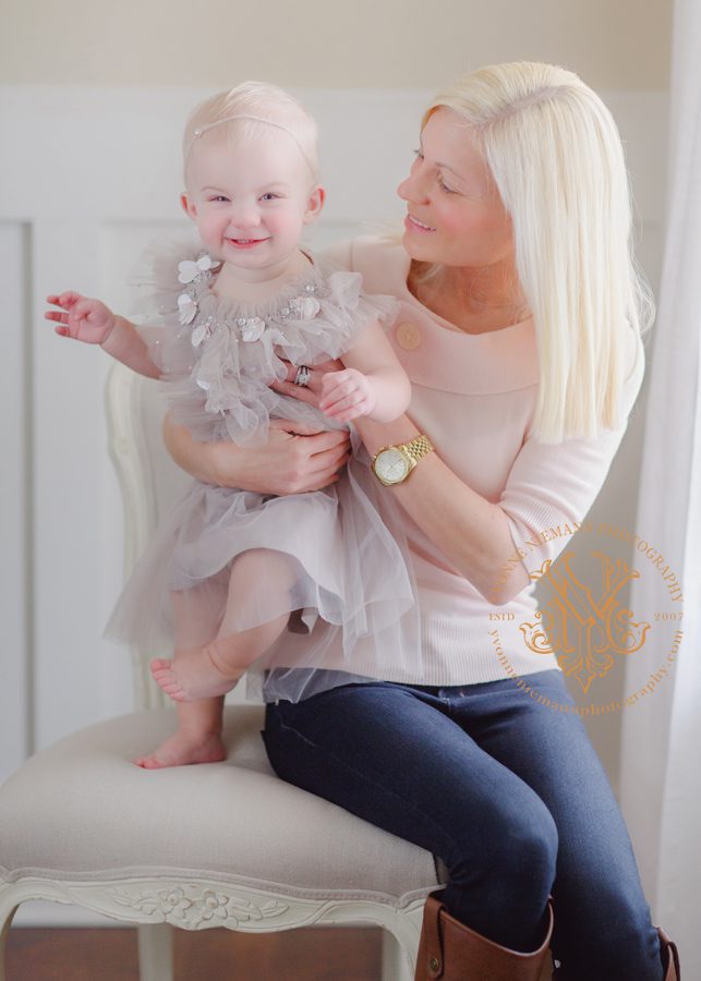 Lifestyle photography showing the love of motherhood between mother and baby daughter in Athens, GA.