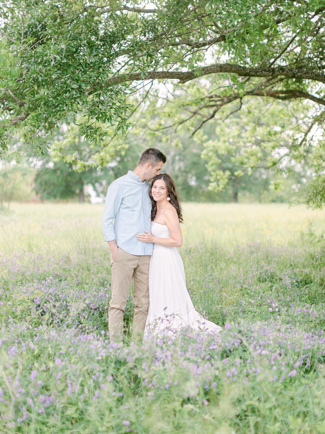 anniversary photos of a couple in a field in Watkinsville, GA
