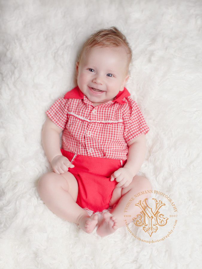 Classic baby photo of a 3 month old baby boy in vintage red outfit in Watkinsville, GA.