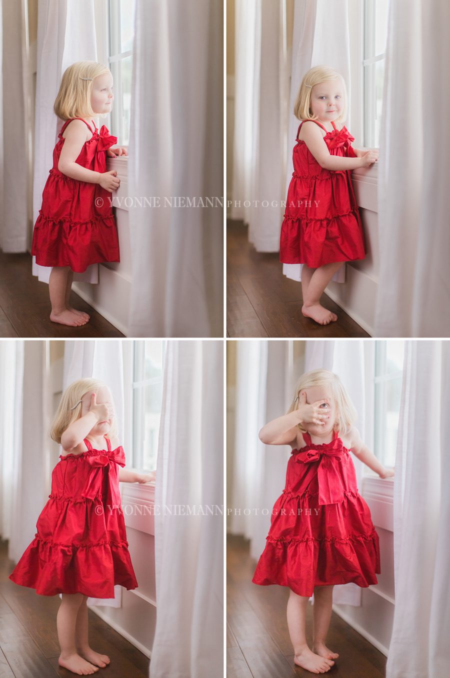 Organic children's photography of a two year old little girl in a red dress looking out her window in Bishop, GA.