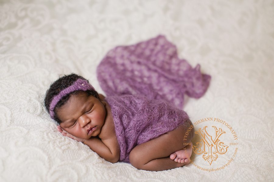 Atlanta infant photography of African American baby girl five days old in purple lace.