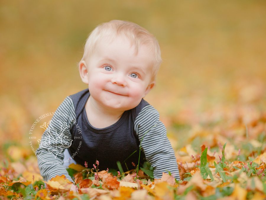 Sweet photo of crawling seven month old baby boy in Fall leaves in Athens, GA.
