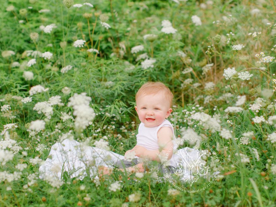 Baby's first birthday portraits in field of flowers in Athens, GA.