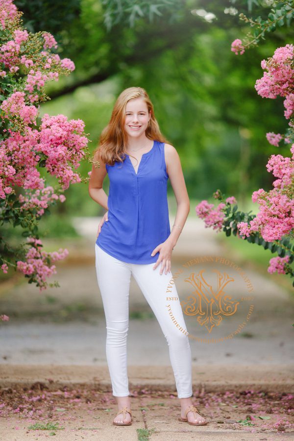 Photo of a high school senior girl among pink blossoms at Tower Grove Park taken by Athens, GA senior photographer