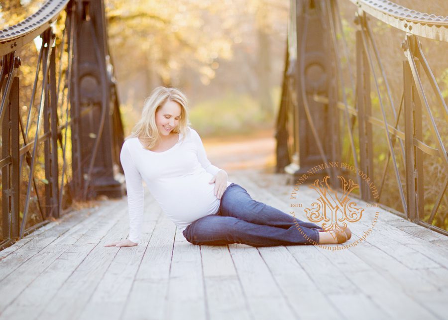Pretty maternity photo of expecting mom to be on a bridge taken by Watkinsville, GA maternity photographer, Yvonne Niemann Photography.