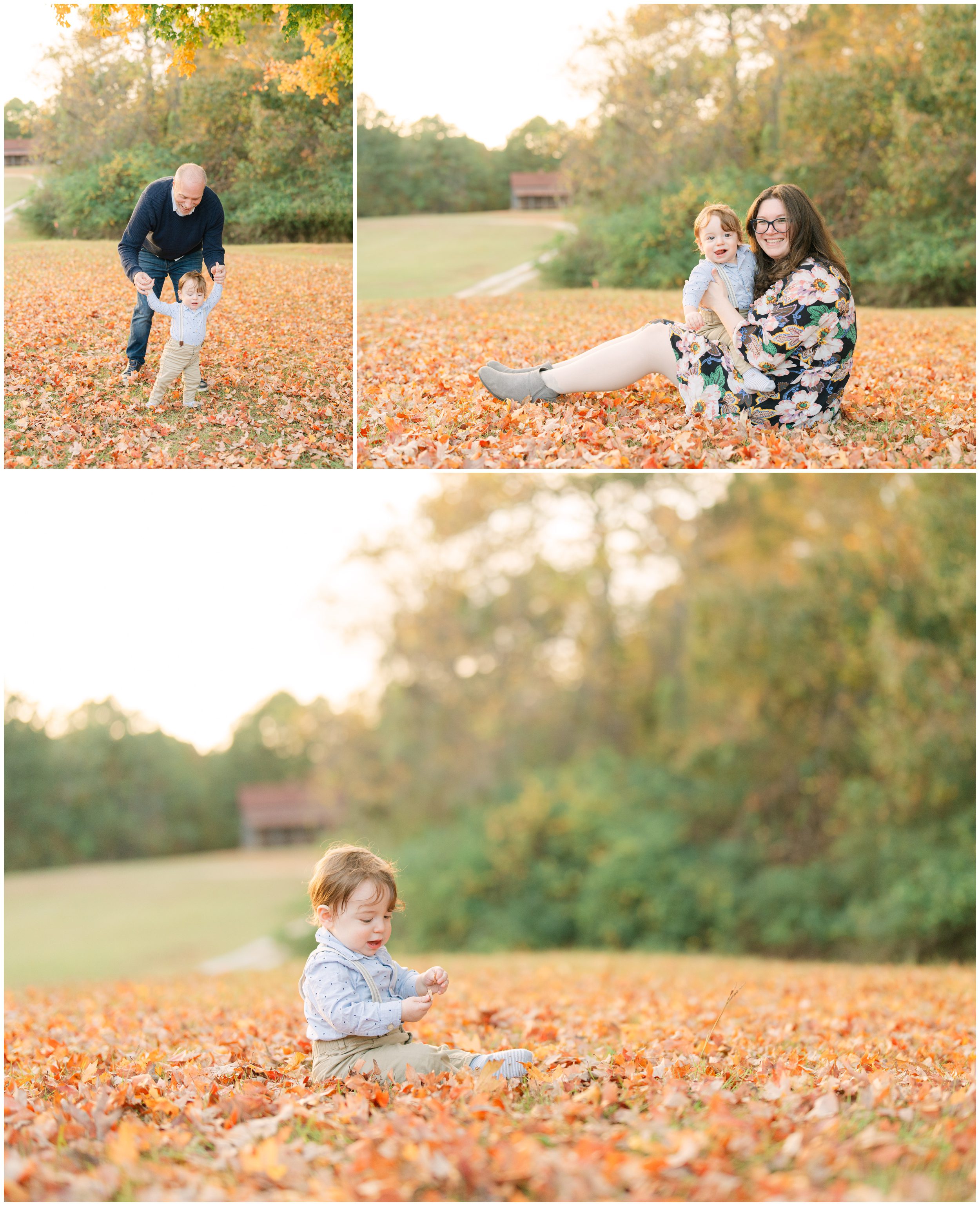 Father helping his baby boy walk and mother cuddling him among vibrant orange fall leaves