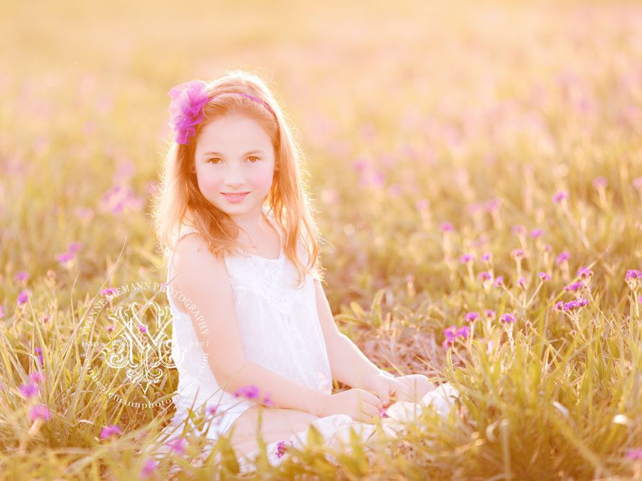 Portrait of a tween girl in a field of purple flowers in Oconee County, GA.