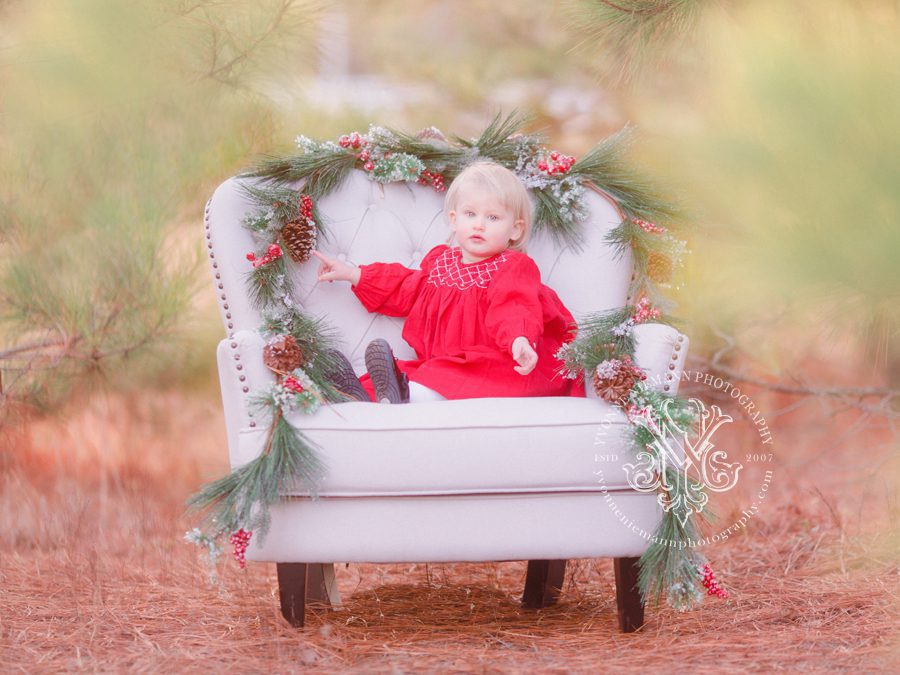 Christmas photo of a one year old baby girl in the woods of Georgia near Athens, GA.