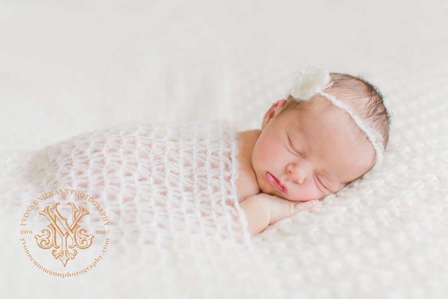Natural newborn photography of sleeping infant girl in Bishop, GA.