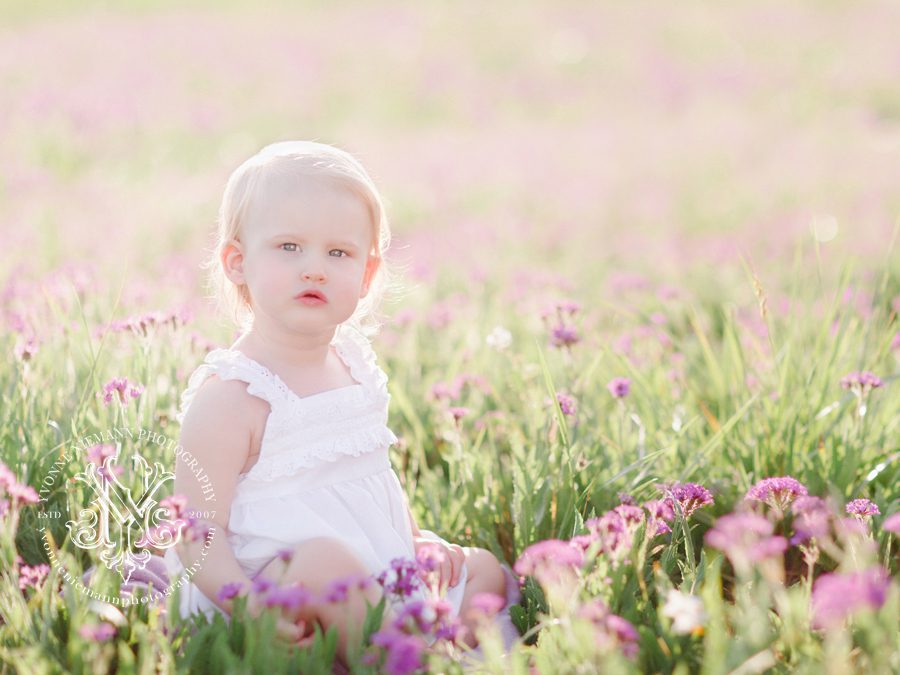 Southern-one-year-old-baby-girl-in-a-field-of-purple-flowers-in-Athens-GA-area