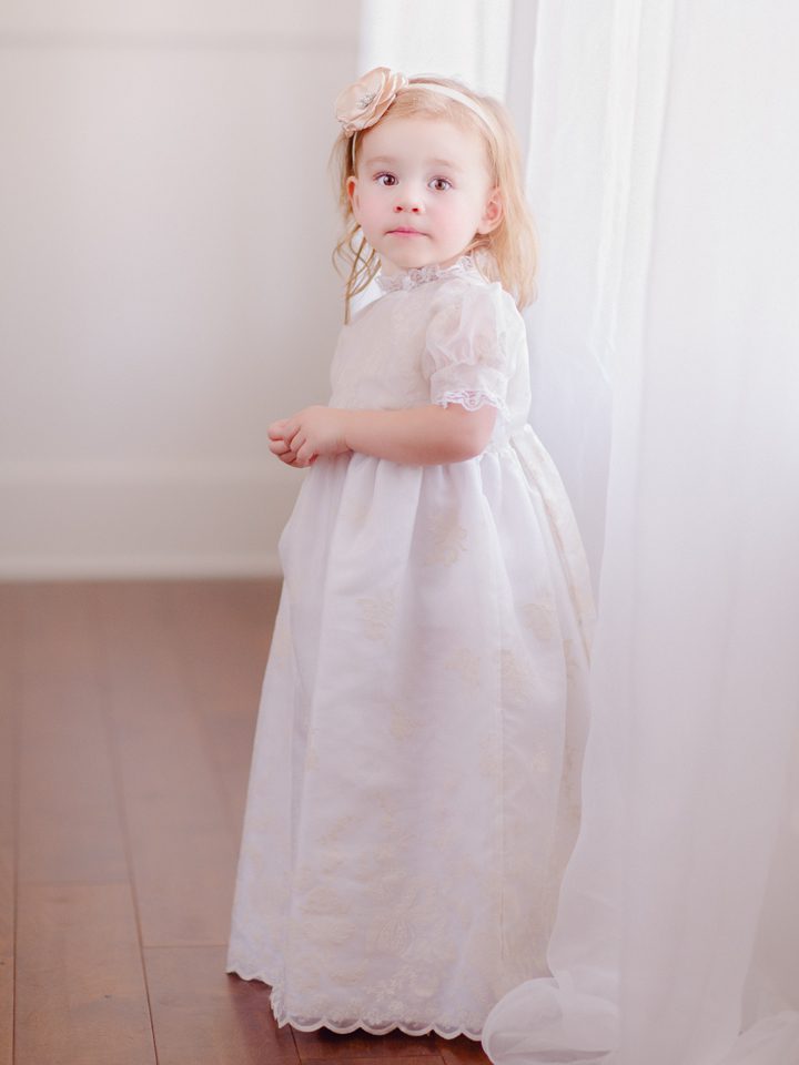 Child photoshoot of a little girl in her baptism dress in Athens, GA.
