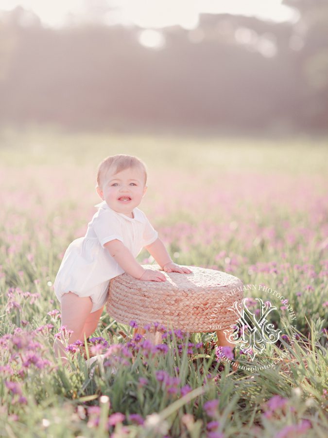 Photo of a nine month old baby boy in a field of purple flowers in Oconee County, GA.
