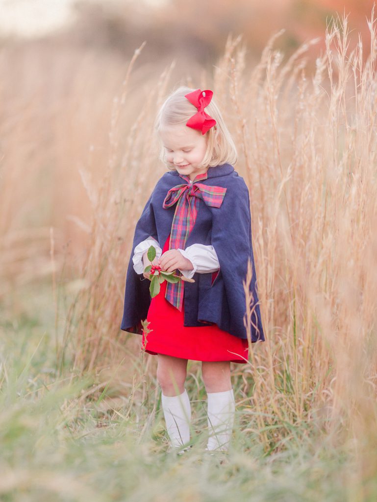 A portrait of a little girl in a field near Athens, GA for her Southern Christmas portraits.