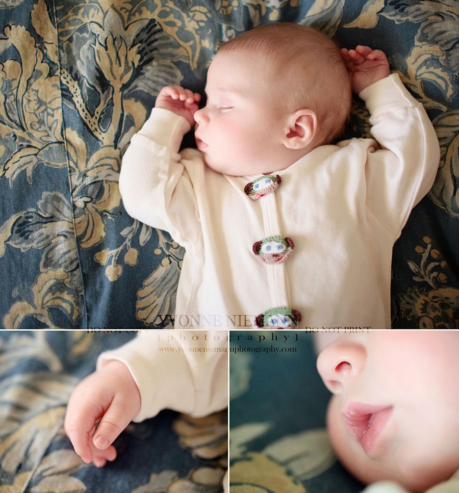 Fenton Baby Photographer captures baby sleeping on parents' bed.