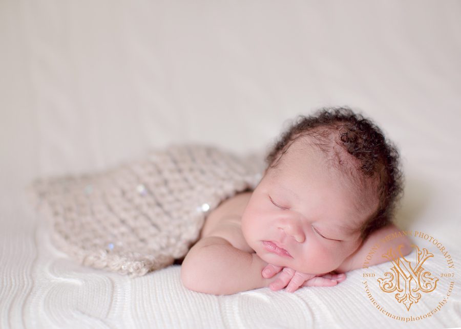 Portrait of seven day old infant sleeping taken by Yvonne Niemann Photography in St Louis.
