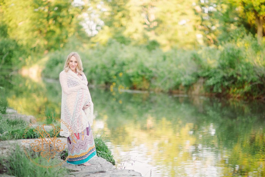 St. Louis Maternity Portrait taken on location by a beautiful stream in the Spring.
