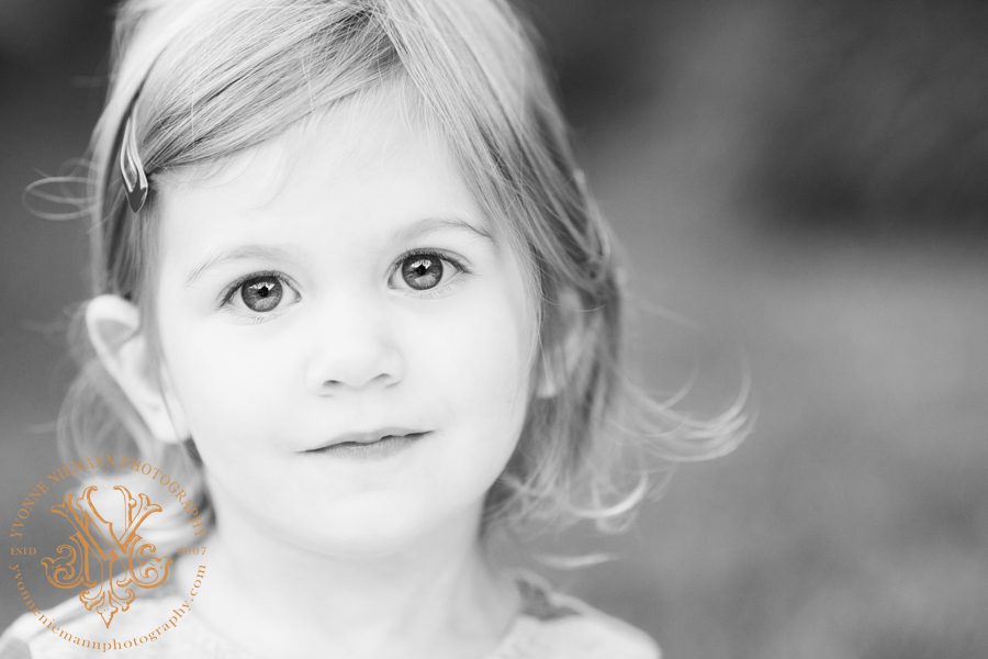 Beautiful black and white child photography of a two year old girl with big eyes taken by Yvonne Niemann Photography in St. Louis.