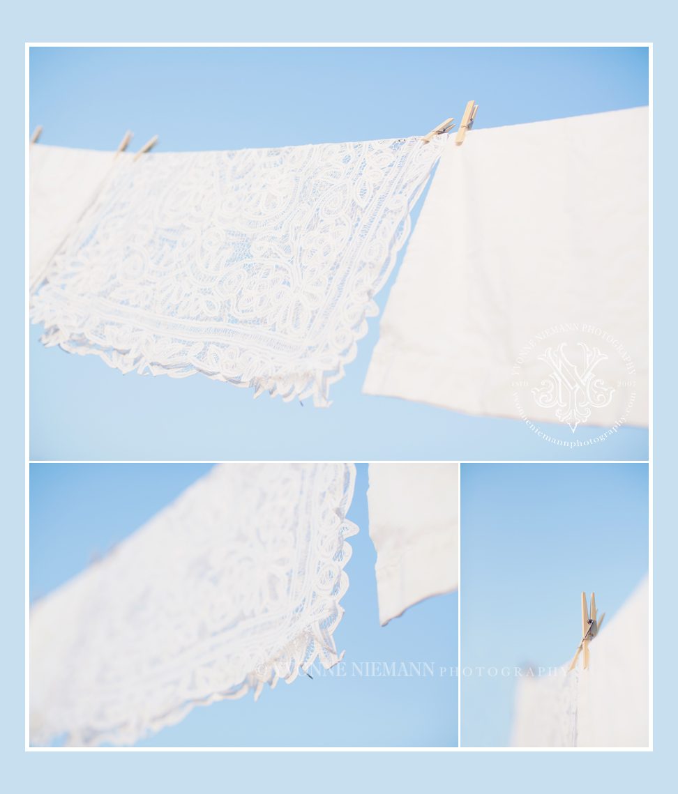 Pictures of white linens on a clothesline with a blue sky taken by Yvonne Niemann Photography.
