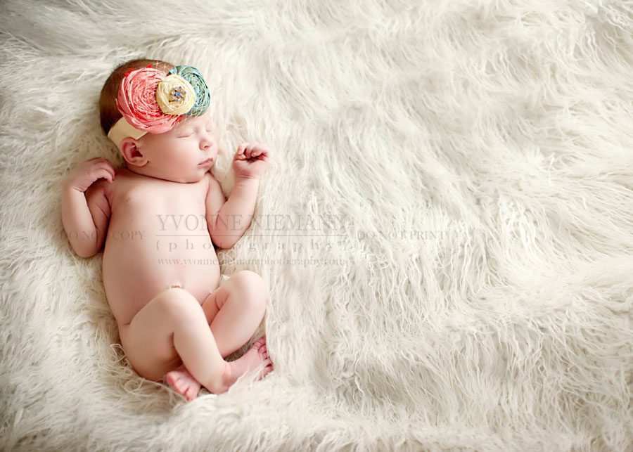 newborn girl with hair accessory