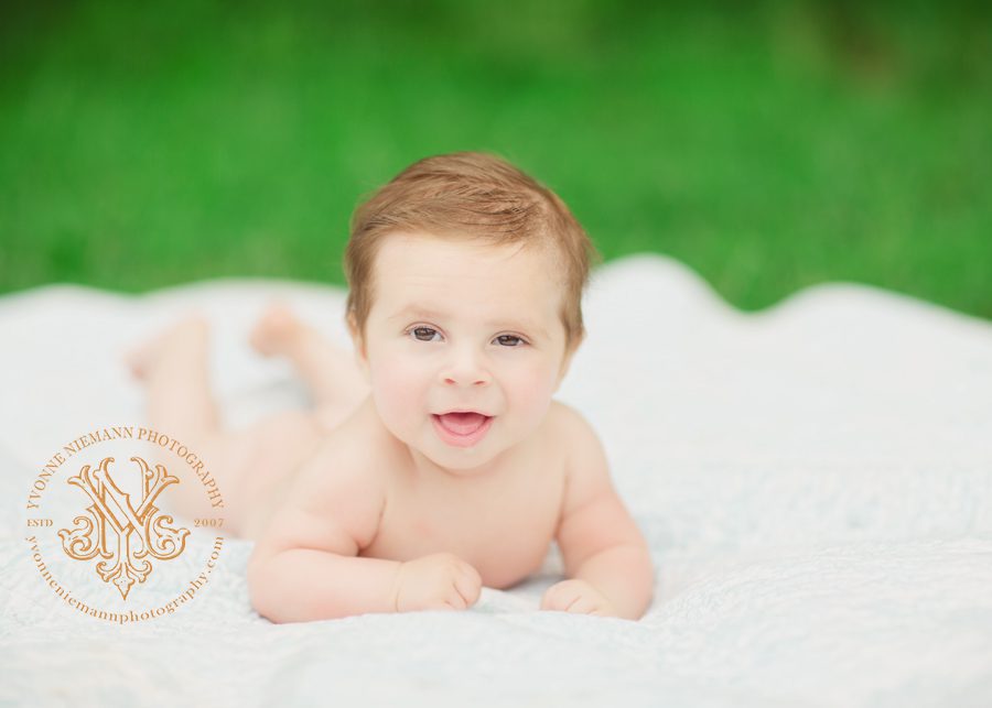 three month old baby boy outside in his birthday suit taken by Yvonne Niemann Photography